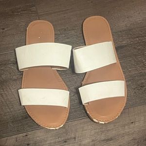 White and tan slip on sandals